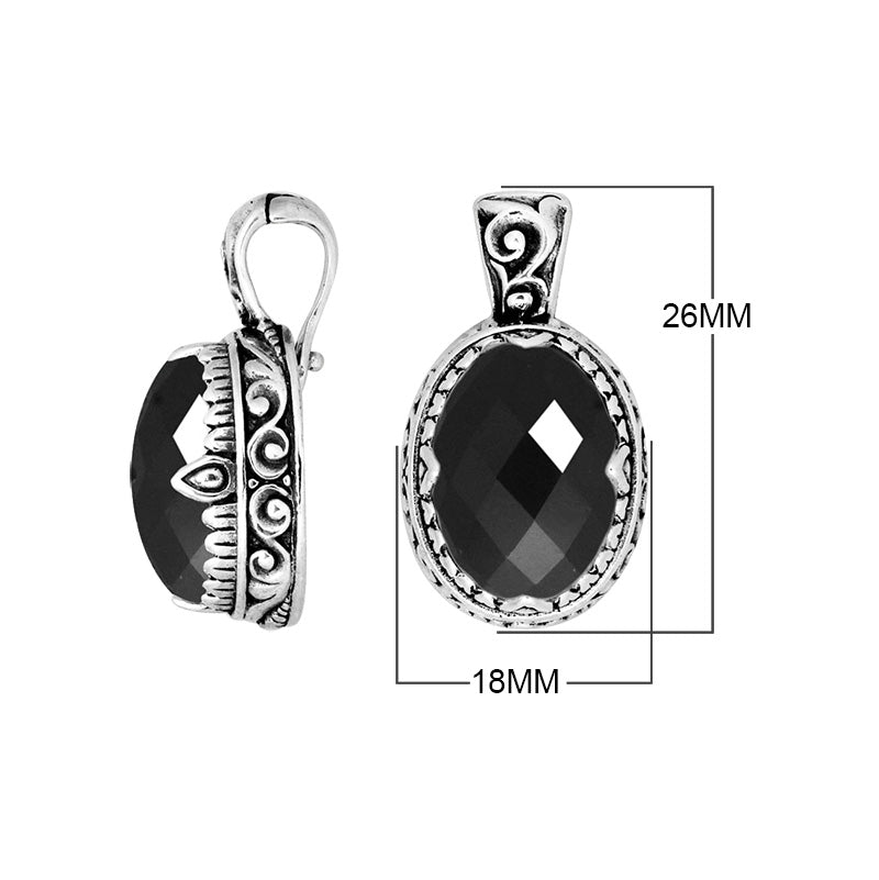 Sterling silver oval pendant featuring a vivid Ruby Quartz centerpiece highlighted by detailed Balinese scroll carvings and a smoothly polished artistic frame design.