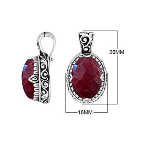 Sterling silver oval pendant featuring a vivid Ruby Quartz centerpiece highlighted by detailed Balinese scroll carvings and a smoothly polished artistic frame design.