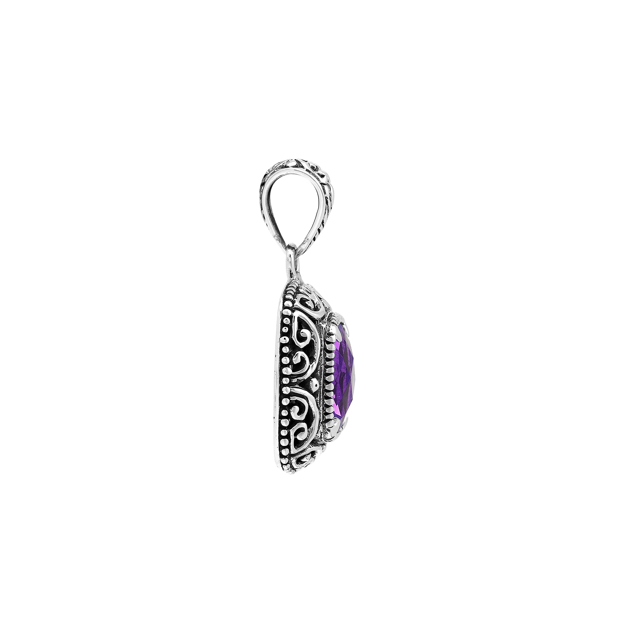 Sterling silver cushion pendant featuring a faceted Amethyst Quartz centerpiece surrounded by ornate Balinese scroll carvings and a polished classic frame.