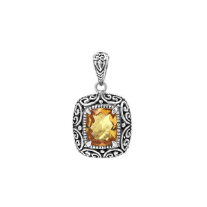 Sterling silver cushion pendant featuring a faceted Citrine Quartz centerpiece accented with intricate Balinese scroll carvings and a polished decorative frame.
