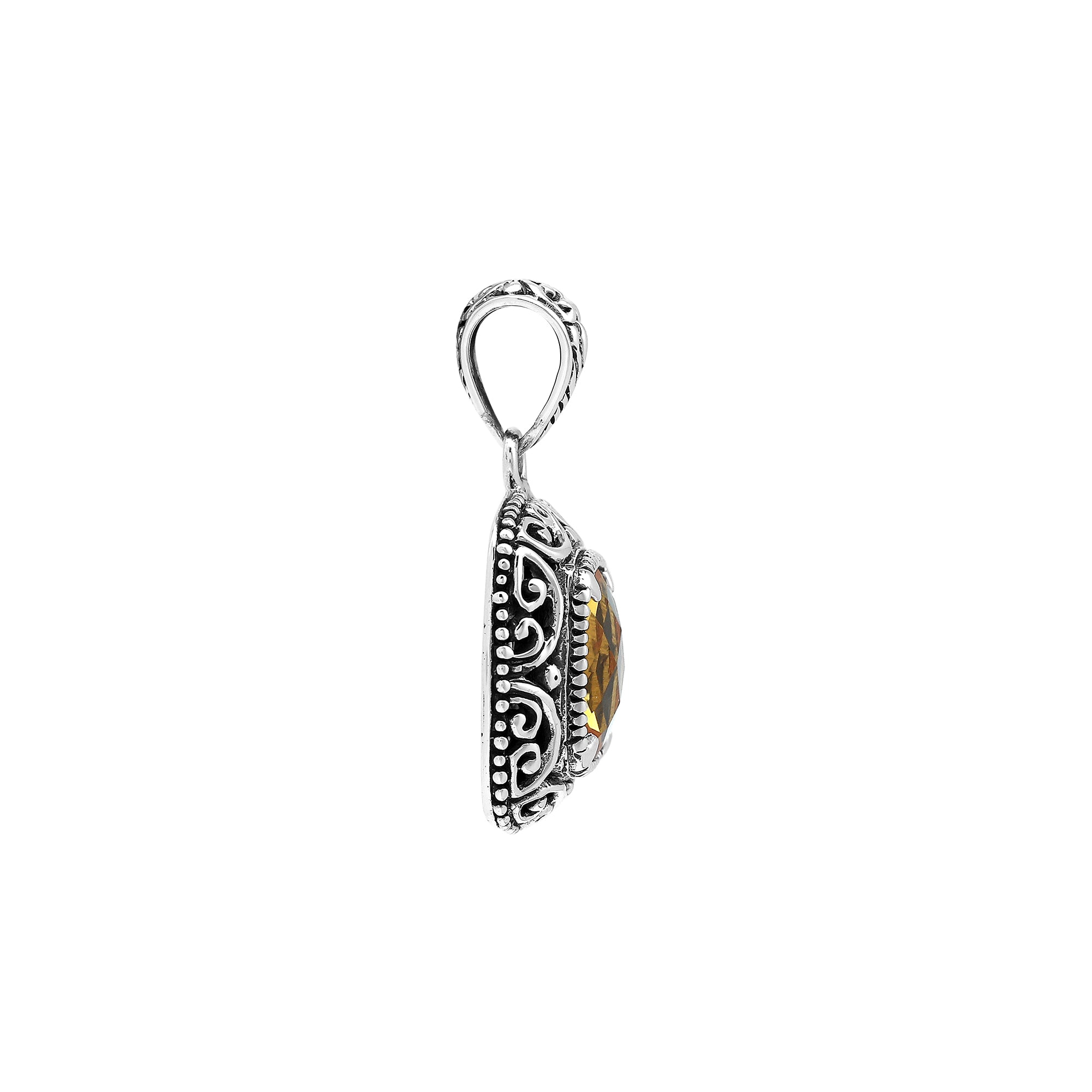 Sterling silver cushion pendant featuring a faceted Citrine Quartz centerpiece accented with intricate Balinese scroll carvings and a polished decorative frame.
