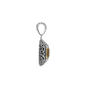 Sterling silver cushion pendant featuring a faceted Citrine Quartz centerpiece accented with intricate Balinese scroll carvings and a polished decorative frame.