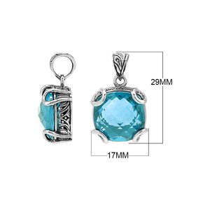 Sterling silver cushion pendant featuring a faceted Blue Topaz Quartz centerpiece secured by artistic prong detailing with traditional Balinese carved accents.