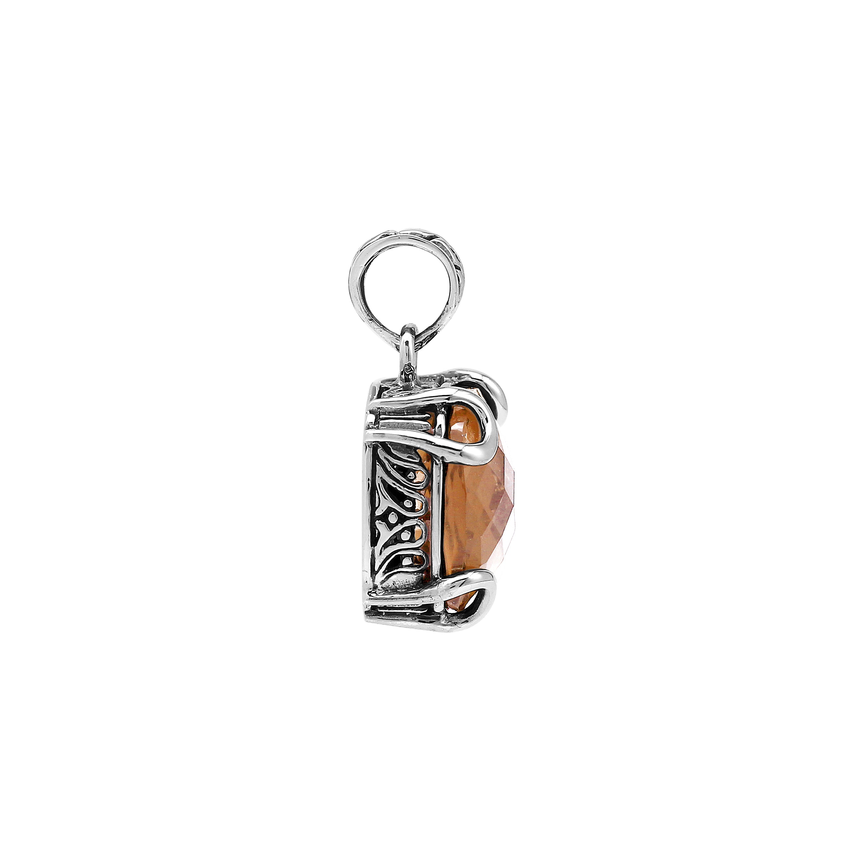Sterling silver cushion pendant featuring a faceted Morganite Quartz centerpiece secured with artistic prong detailing and traditional Balinese carved embellishments.