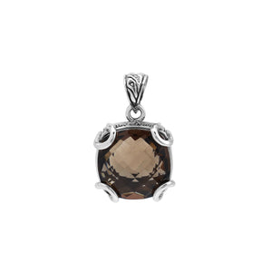 Sterling silver cushion pendant featuring a faceted Smokey Quartz centerpiece secured with decorative prong detailing and traditional Balinese carved ornamentation.
