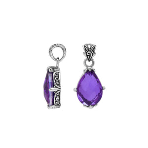 Sterling silver pear-shaped pendant featuring a faceted Amethyst Quartz centerpiece with polished prong-setting and traditional Balinese carved ornamental accents.