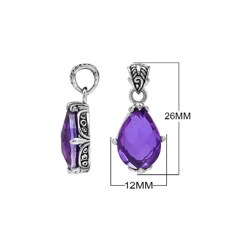 Sterling silver pear-shaped pendant featuring a faceted Amethyst Quartz centerpiece with polished prong-setting and traditional Balinese carved ornamental accents.