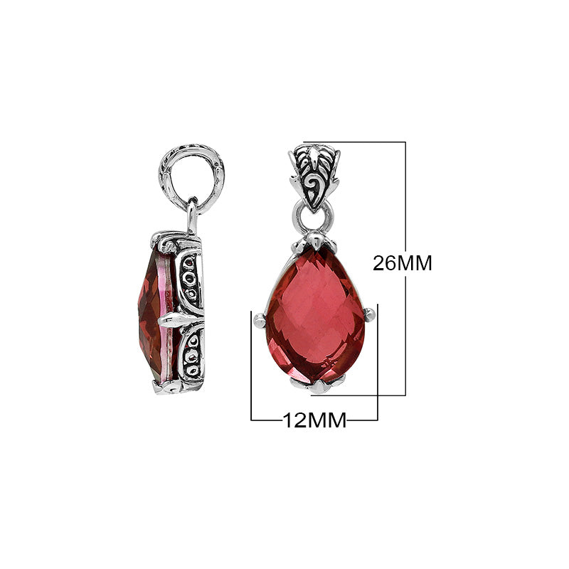 Sterling silver pear-shaped pendant featuring a faceted Red Garnet Quartz center with polished prong-setting and intricate Balinese carved ornamental accents.