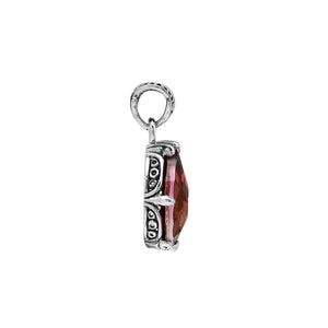 Sterling silver pear-shaped pendant featuring a faceted Red Garnet Quartz center with polished prong-setting and intricate Balinese carved ornamental accents.