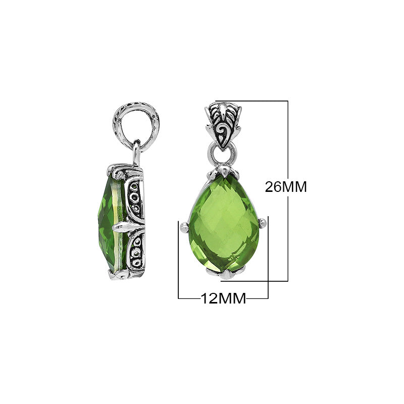 Sterling silver pear-shaped pendant featuring a faceted Peridot Quartz centerpiece with polished prong-setting and detailed Balinese carved ornamental accents.