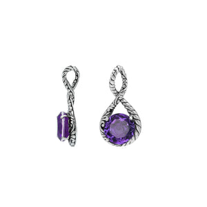 Sterling silver twisted loop pendant featuring a faceted Amethyst Quartz centerpiece with polished round setting and detailed Balinese engraved accents.