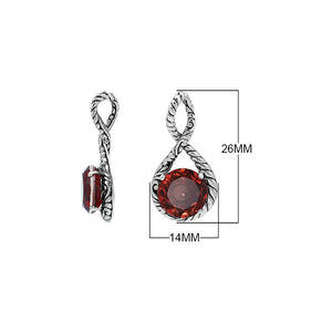 Sterling silver twisted loop pendant featuring a round faceted Red Garnet Quartz centerpiece with carved Balinese detailing and polished artistic round setting.
