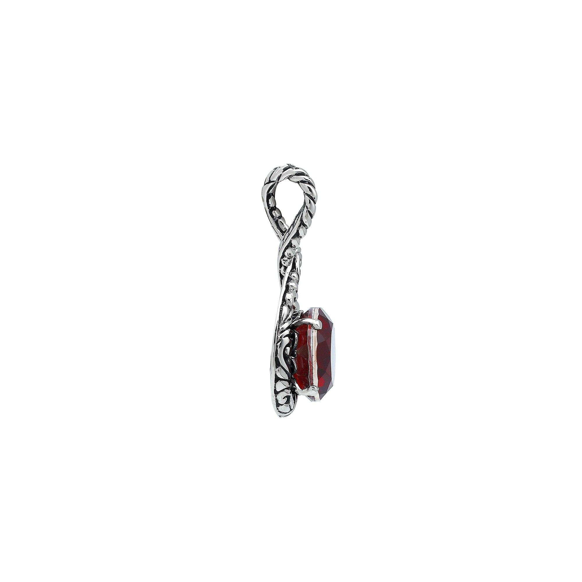 Sterling silver twisted loop pendant featuring a round faceted Red Garnet Quartz centerpiece with carved Balinese detailing and polished artistic round setting.