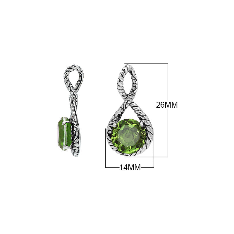 Sterling silver twisted loop pendant featuring a round Peridot Quartz centerpiece with carved Balinese engraving and polished artistic round design.