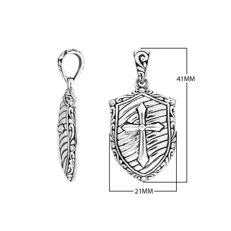 Shield-shaped sterling silver pendant featuring an engraved cross symbol with textured detailing and polished borders suitable for classic wholesale jewelry presentations