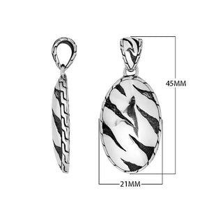 Wholesale sterling silver oval pendant with abstract carved black pattern.