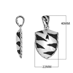 Wholesale sterling silver shield pendant with oxidized wavy carved pattern.