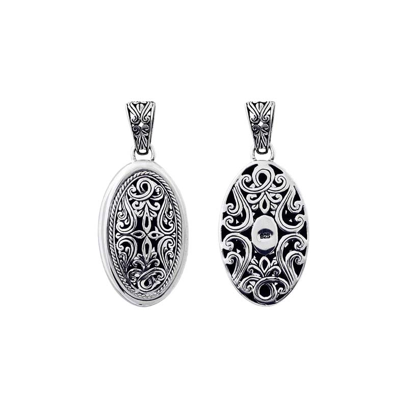 A wholesale Silver Overlay Over Copper oval pendant featuring intricate Balinese filigree detailing, oxidized depth, ornate scrollwork, and polished silver highlights ideal for bulk jewelry buyers.