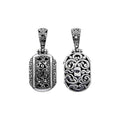 A wholesale Silver Overlay Over Copper oval pendant featuring ornate Balinese scrollwork, oxidized detailing, polished highlights, and a refined silver overlay design ideal for bulk jewelry buyers.