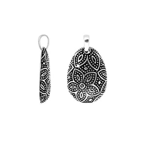 A wholesale Silver Overlay Over Copper pendant featuring oxidized floral etching, dotted detailing, polished overlay texture, and traditional Balinese artistry ideal for bulk jewelry purchasing.