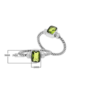 Wholesale sterling silver twisted band ring with rectangular-cut Peridot Quartz, handcrafted artisan jewelry in bulk for retailers and resellers.