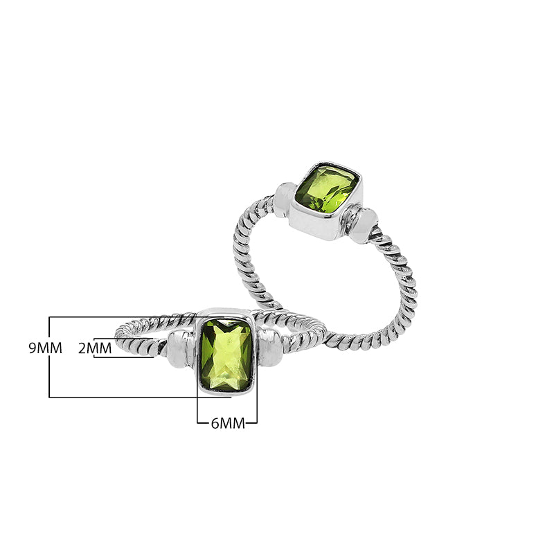 Wholesale sterling silver twisted band ring with rectangular-cut Peridot Quartz, handcrafted artisan jewelry in bulk for retailers and resellers.