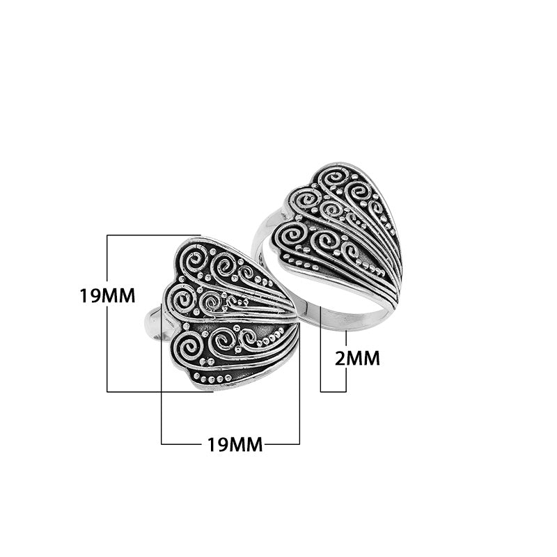 Wholesale sterling silver adjustable ring with dual Balinese swirl and dot panels, handcrafted in Bali, artisan bulk jewelry design.