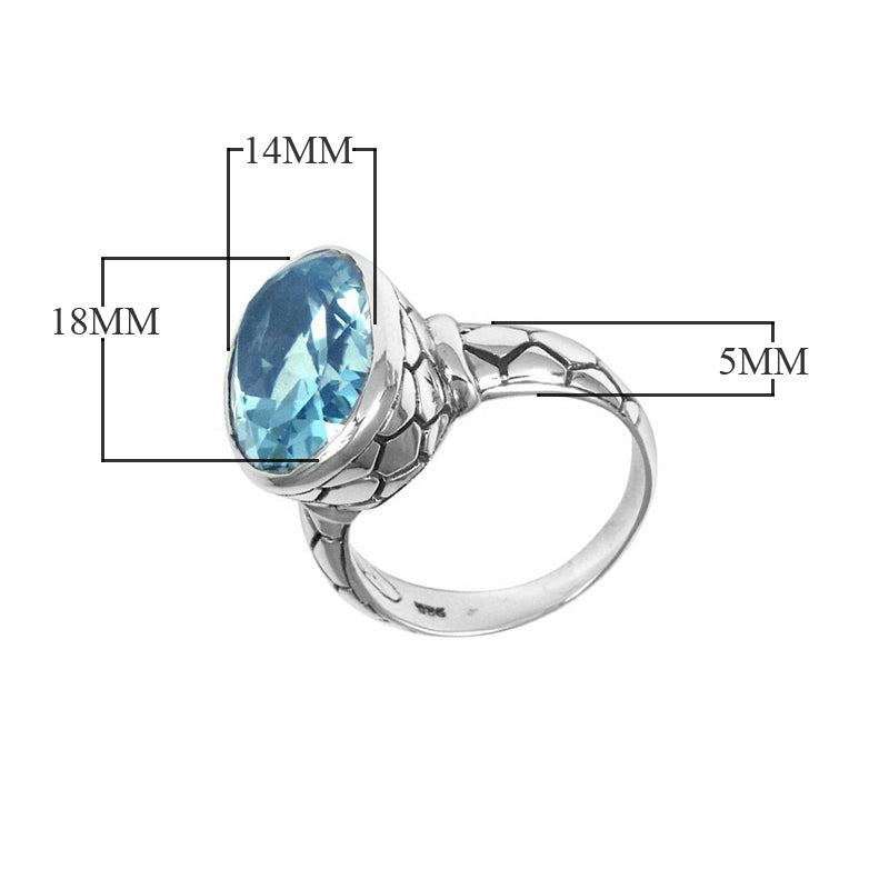 Sterling silver wholesale ring with oval Blue Topaz Quartz and textured carved band, handcrafted in Bali.