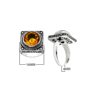 Sterling silver wholesale ring with a round citrine quartz set in a square ornate frame, handcrafted in Bali.