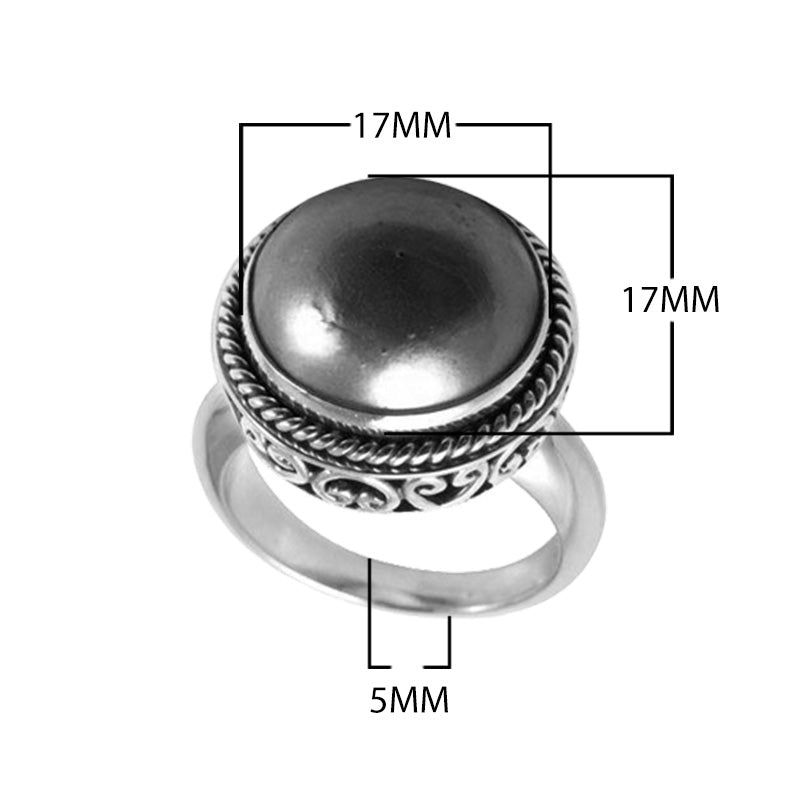 Wholesale sterling silver hematite ring with polished cabochon stone, rope bezel, and Balinese scroll detailing – handcrafted artisan jewelry from Bali.