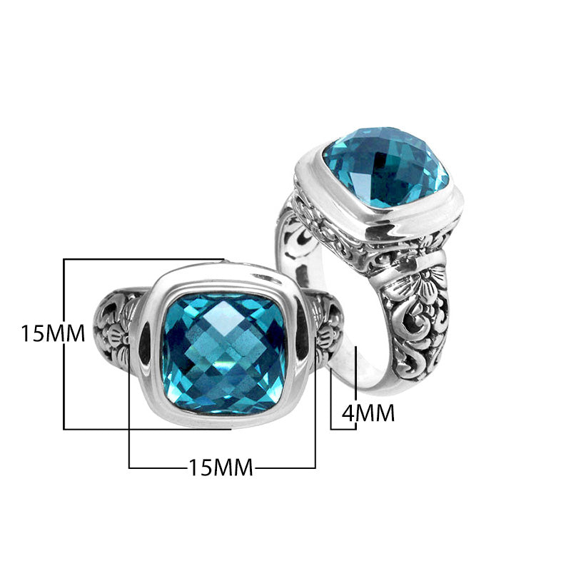 Sterling silver ring with cushion-cut Blue Topaz Quartz and Balinese scroll carvings.