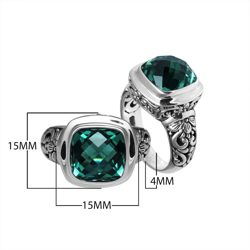 Sterling silver ring with cushion-cut Green Quartz and Balinese scroll carvings.