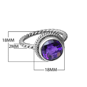 Sterling silver ring with a round Amethyst Quartz and rope-style band design.