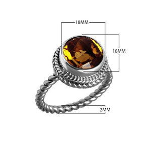 Sterling silver ring with a round Citrine Quartz and rope-style band design.