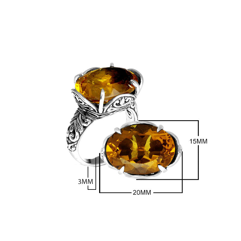 Sterling silver statement ring with oval Citrine Quartz and Balinese scrollwork, handcrafted in Bali.