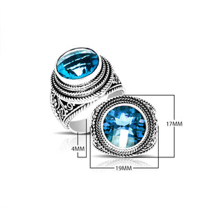 Sterling silver handcrafted Bali ring with round Blue Topaz Quartz and rope scroll design.