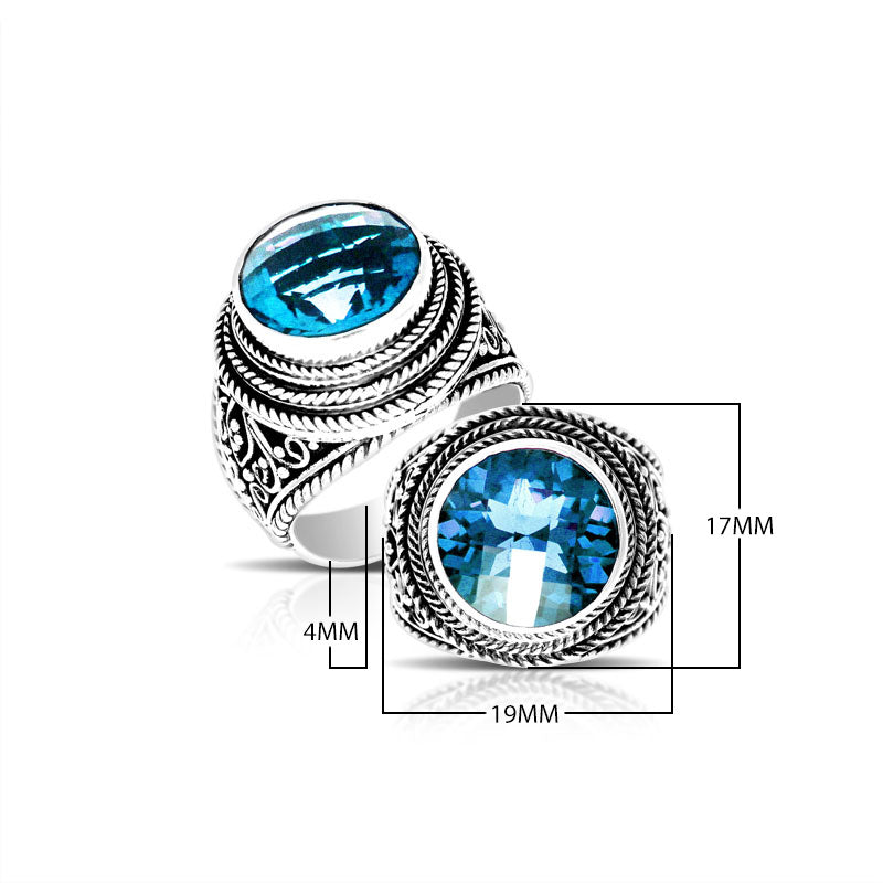 Sterling silver handcrafted Bali ring with round Blue Topaz Quartz and rope scroll design.