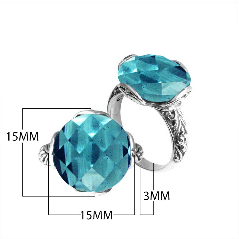 Sterling silver ring with faceted round Blue Topaz Quartz and Balinese scrollwork handcrafted in Bali.