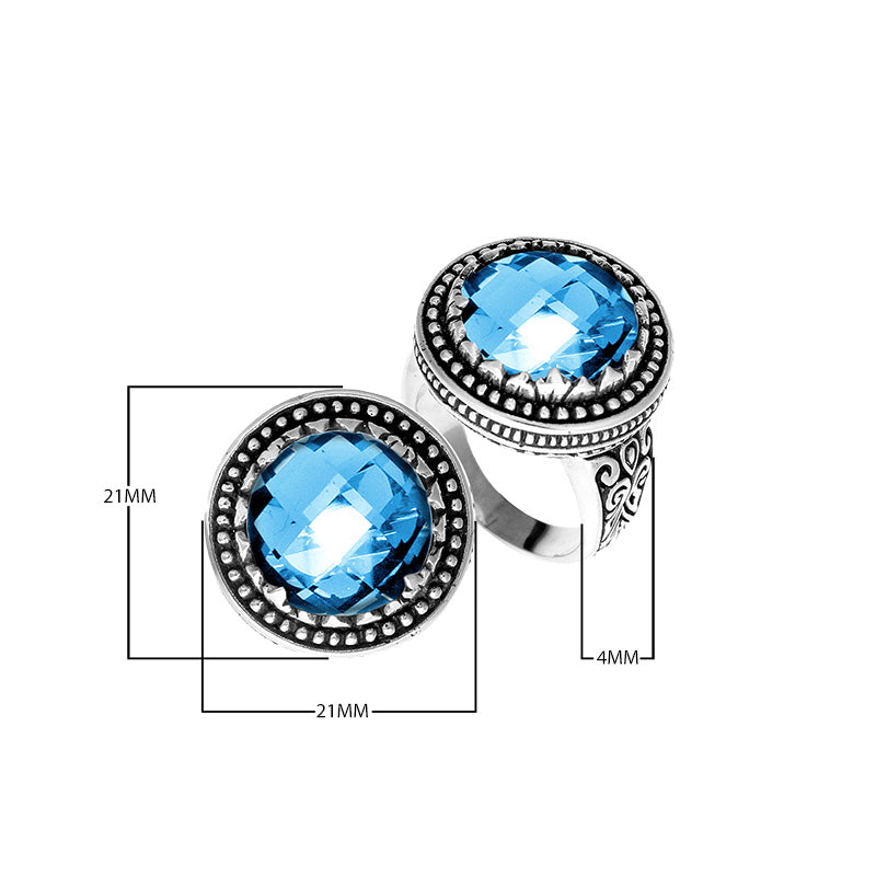 Sterling silver ring with faceted Blue Topaz Quartz, beaded halo, and Balinese carvings handcrafted in Bali.