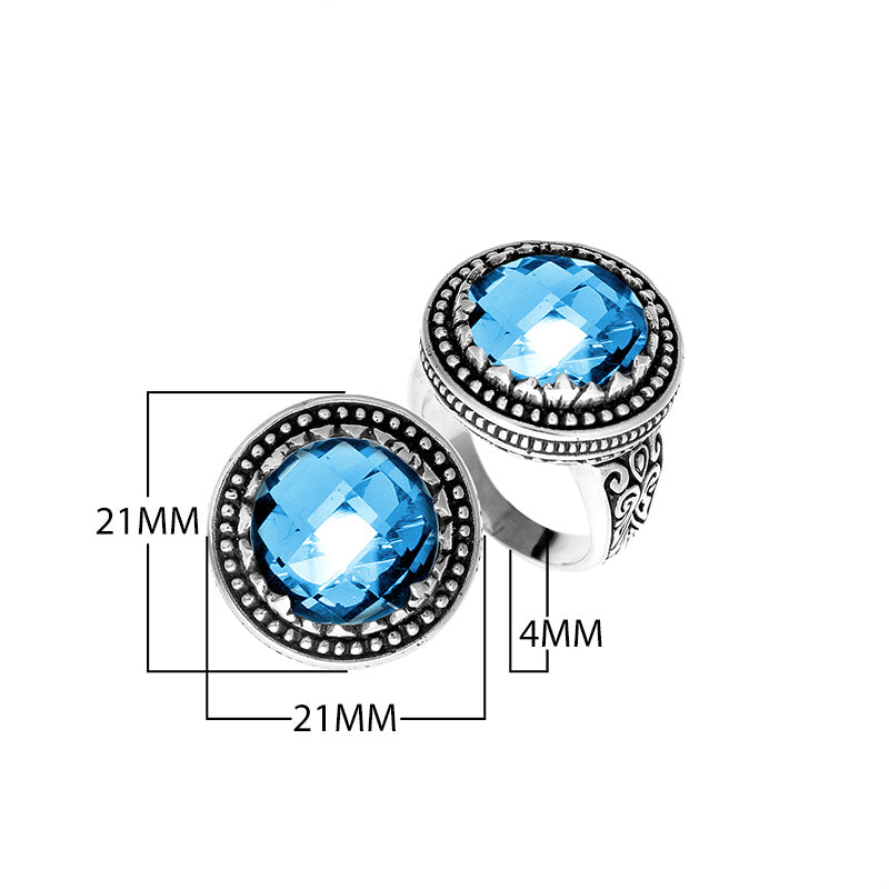 Sterling silver ring with faceted Blue Topaz Quartz, beaded halo, and Balinese carvings handcrafted in Bali.
