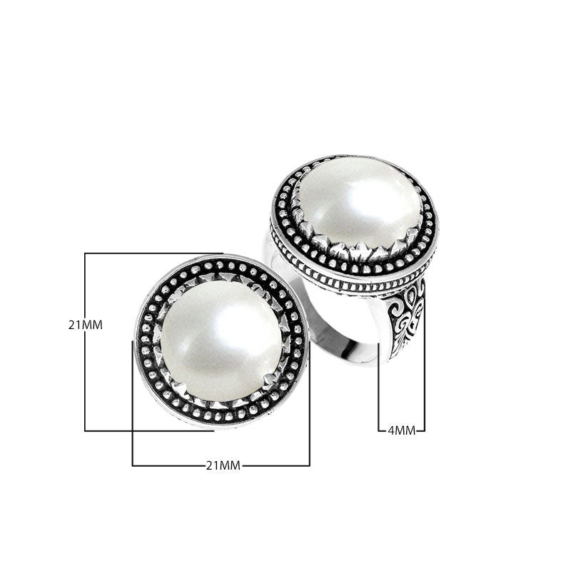 Sterling silver handcrafted Bali ring with Mother of Pearl cabochon and beaded halo design.