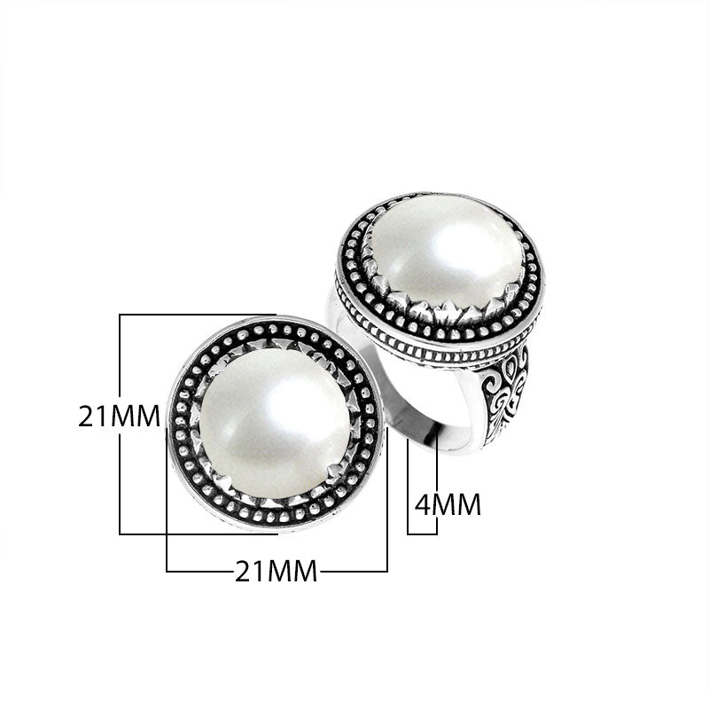 Sterling silver handcrafted Bali ring with Mother of Pearl cabochon and beaded halo design.