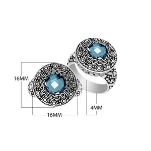 Wholesale sterling silver ring with round Blue Topaz Quartz in an ornate engraved Balinese bezel.