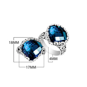 Wholesale sterling silver ring with cushion-cut London Blue Topaz Quartz and Balinese scrollwork.