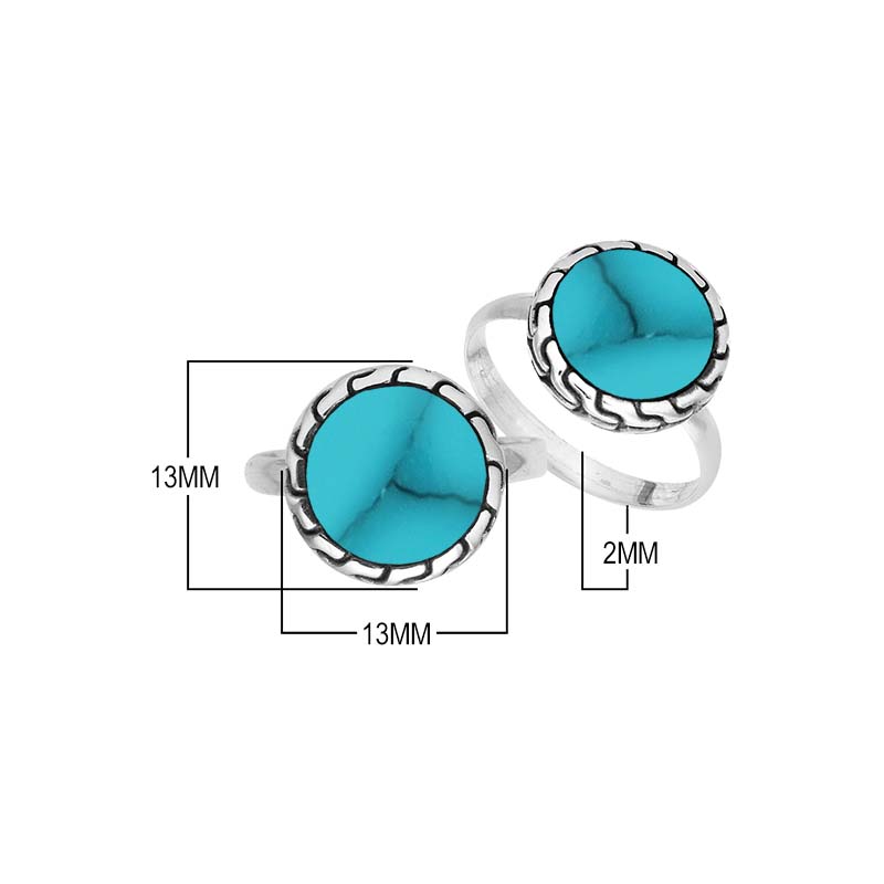 Sterling silver round Turquoise Shell statement ring featuring a vibrant blue centerpiece, sculpted decorative border, oxidized detailing, and polished silver band.