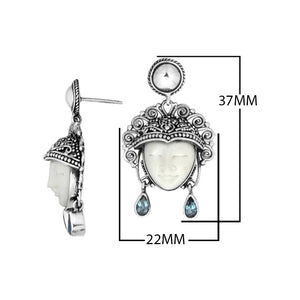 Sterling Silver Carved Bone Face Earrings With Blue Topaz Quartz Teardrop Accents