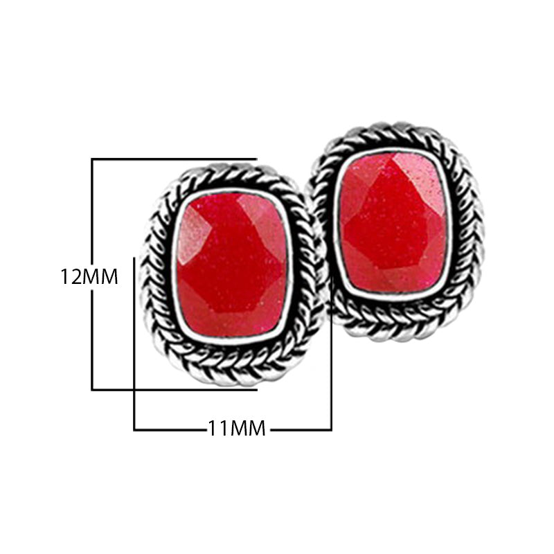 Sterling Silver Stud Earrings With Cushion Ruby And Braided Border Detailing.