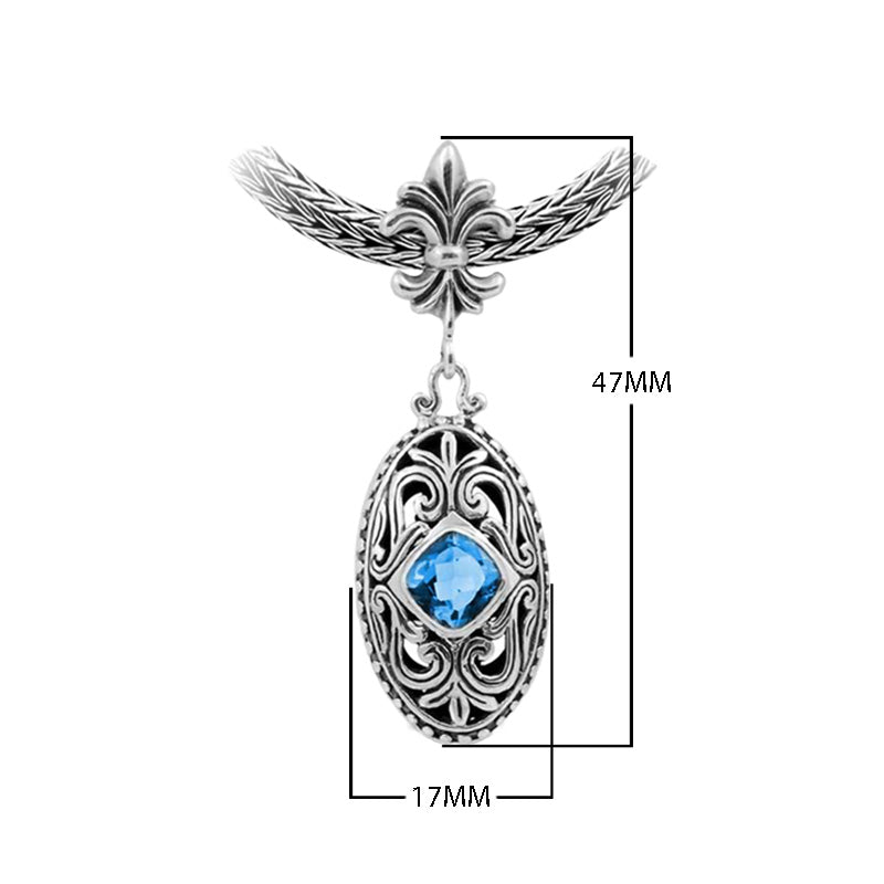 Sterling Silver Ornate Oval Pendant Featuring Blue Topaz Quartz With Fleur-De-Lis Decorative Bail.
