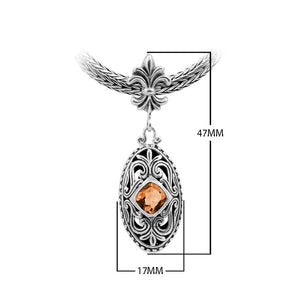Sterling Silver Ornate Oval Pendant Featuring Citrine Quartz With Fleur-De-Lis Decorative Bail.