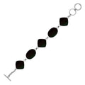 Sterling silver bracelet with oval and cushion black shell links, polished finish.